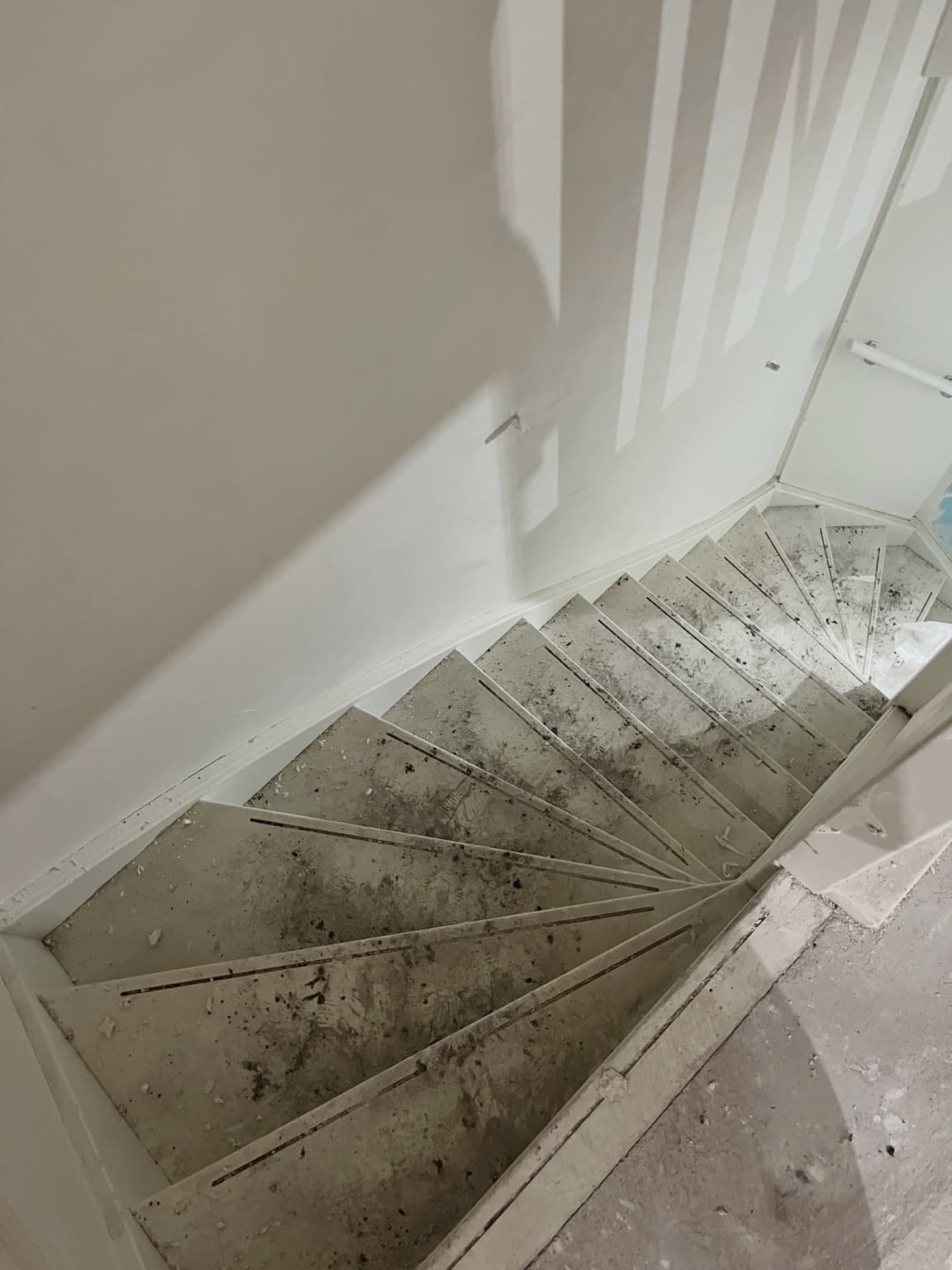 Unfinished dusty staircase during work on a new-build home.