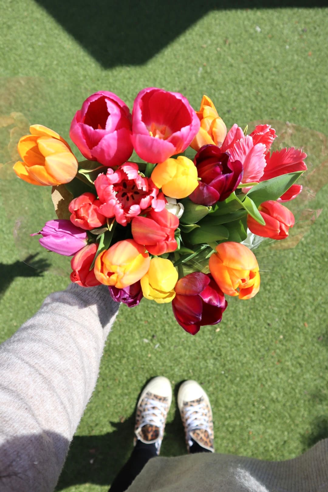 Colourful tulip bouquet carried home after a market visit.