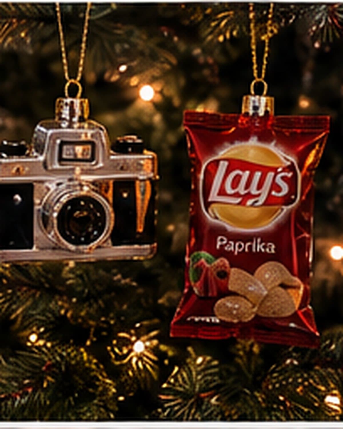 A warm Christmas-at-home moment with tree lights, ornaments, coffee and a wrapped gift.