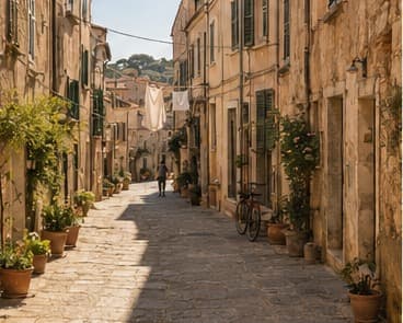 A narrow stone street winding through Cortelume with sunlit steps and shadowed doorways.