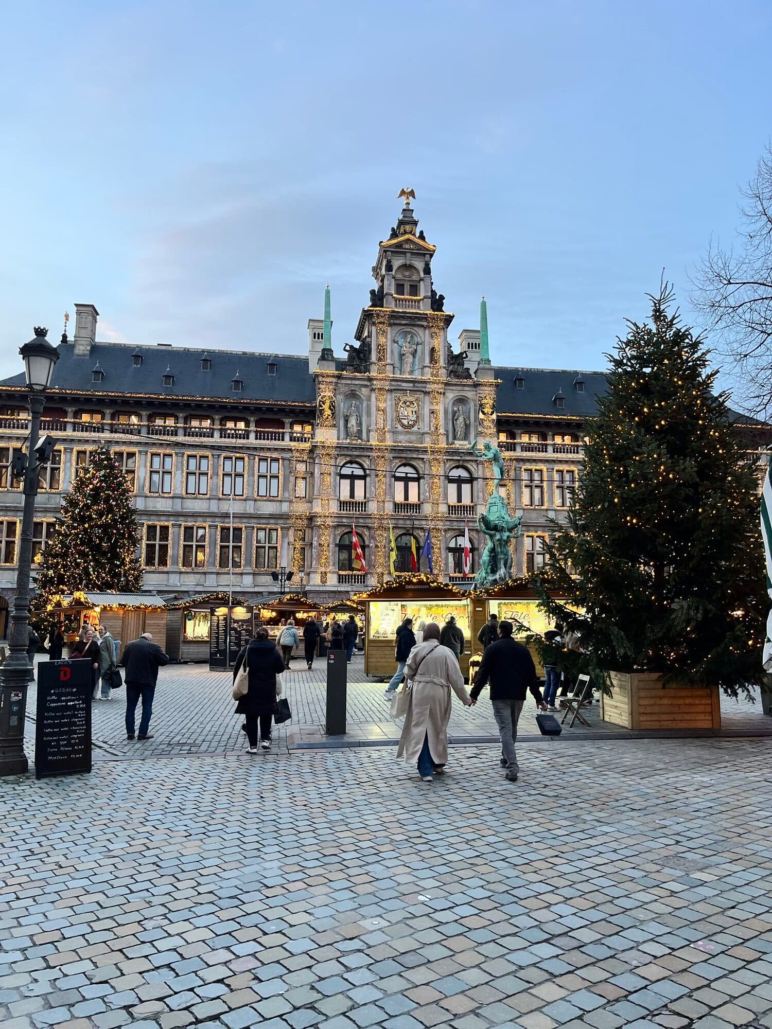 Antwerp’s Grote Markt and guildhouses decorated with Christmas lights at dusk