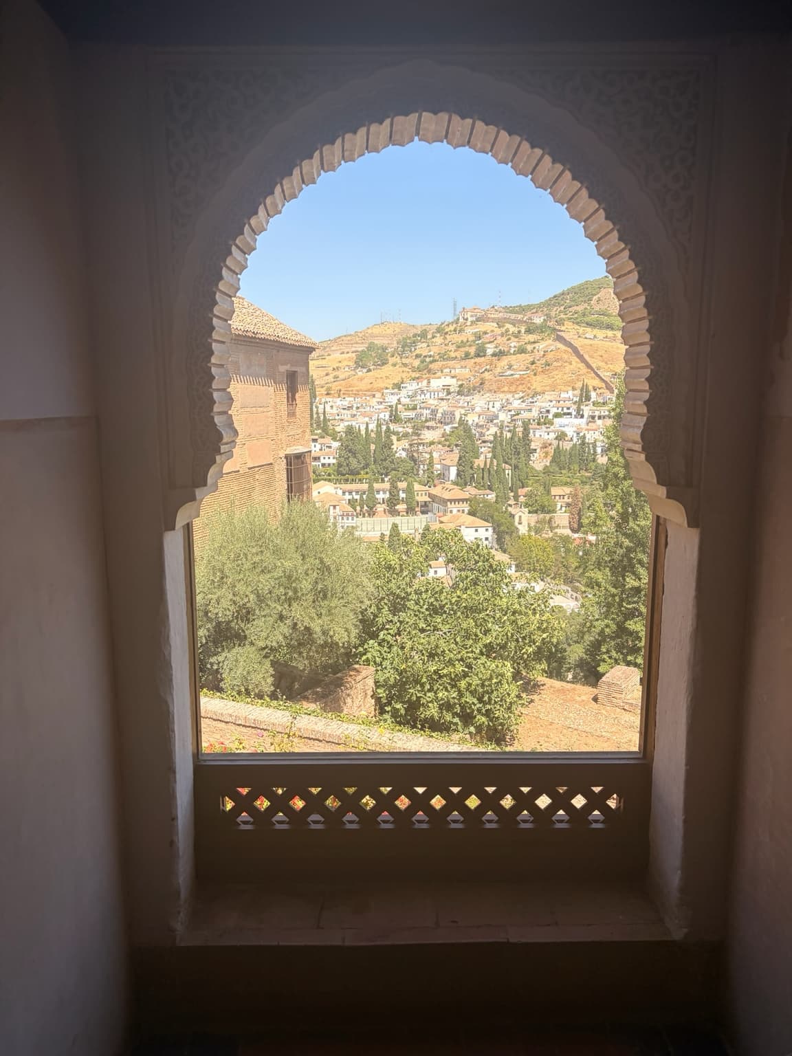 View framed by a Moorish arch at the Alhambra