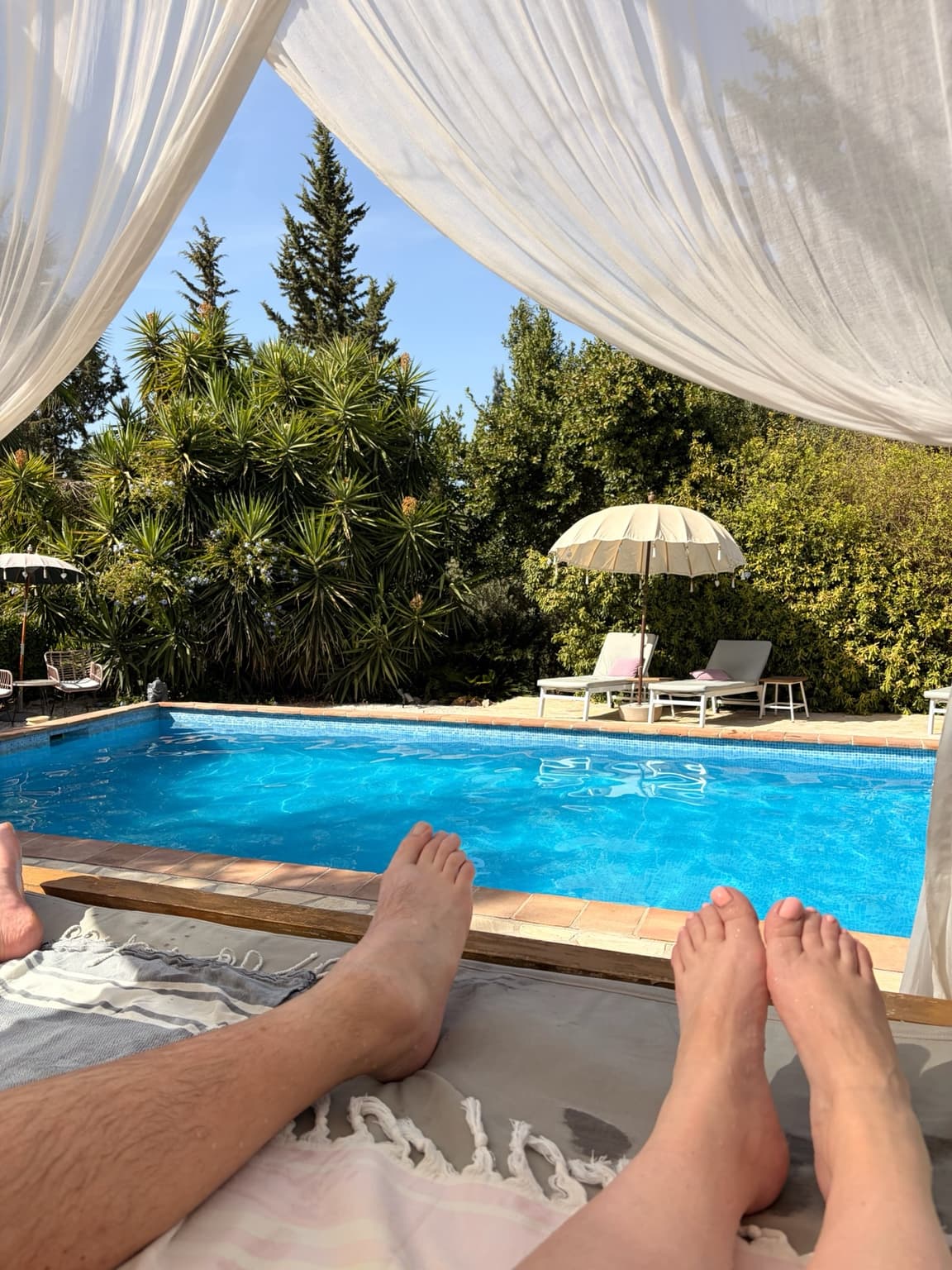 Daybeds beside the pool at Casa Baliza