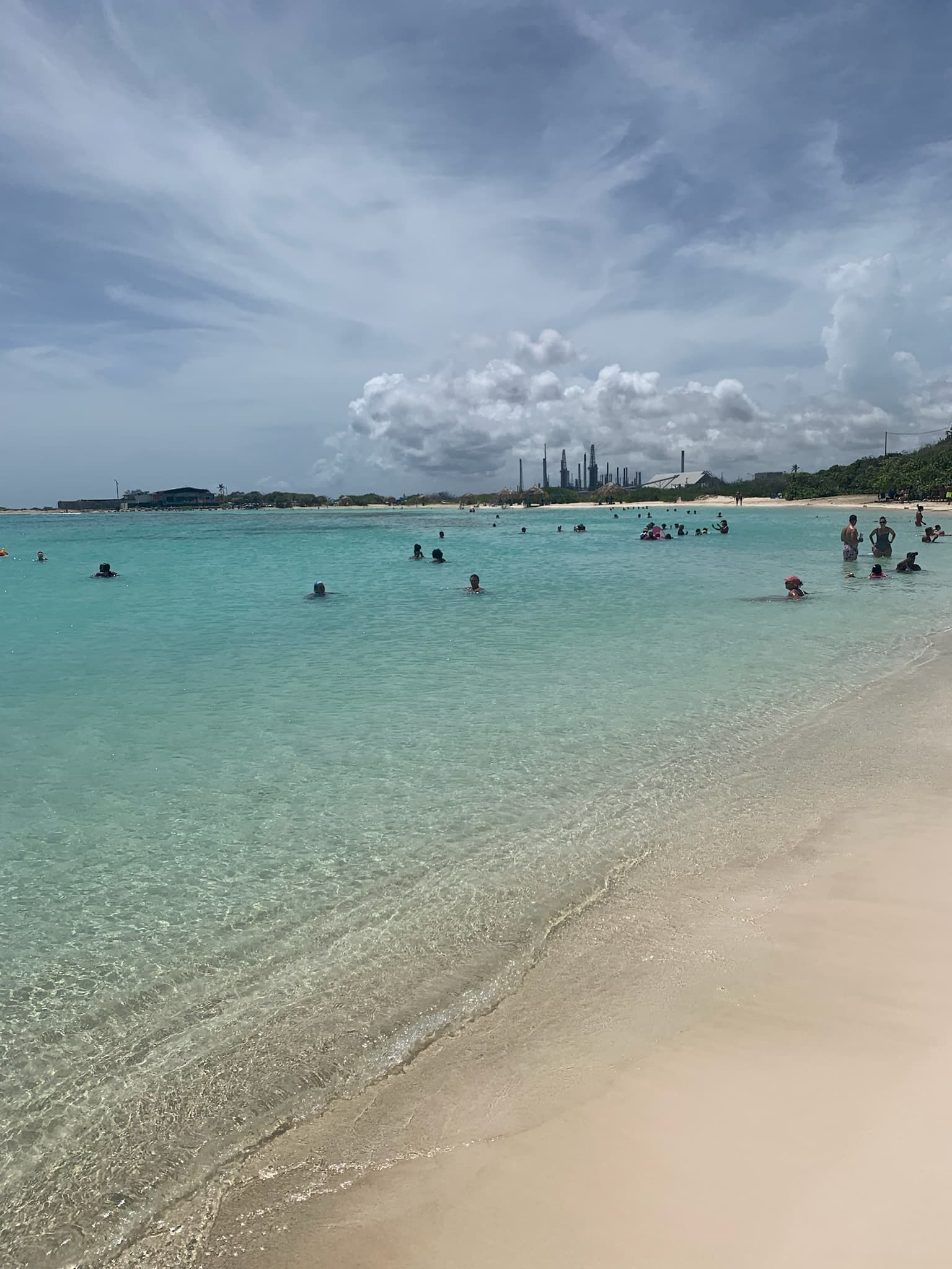 Clear shallow turquoise water and white sand at Baby Beach, Aruba