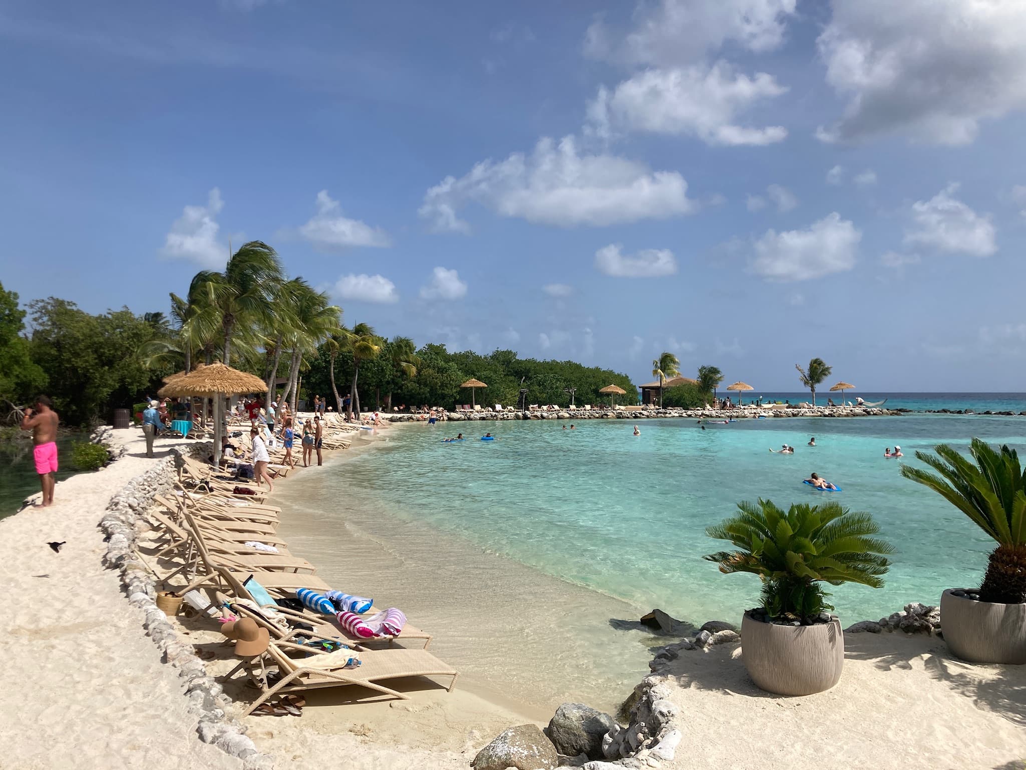 Sheltered turquoise lagoon and cabanas on Renaissance Island