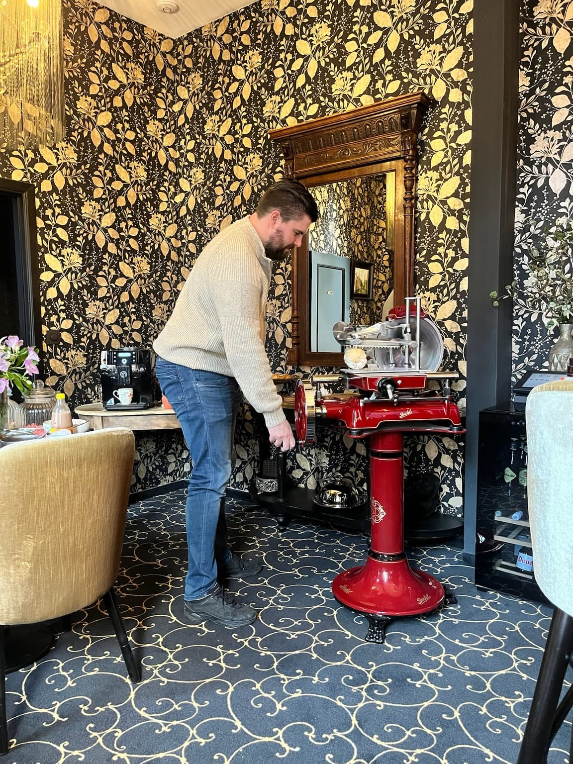 Decorative breakfast room at Hotel De Orangerie with a vintage slicing machine
