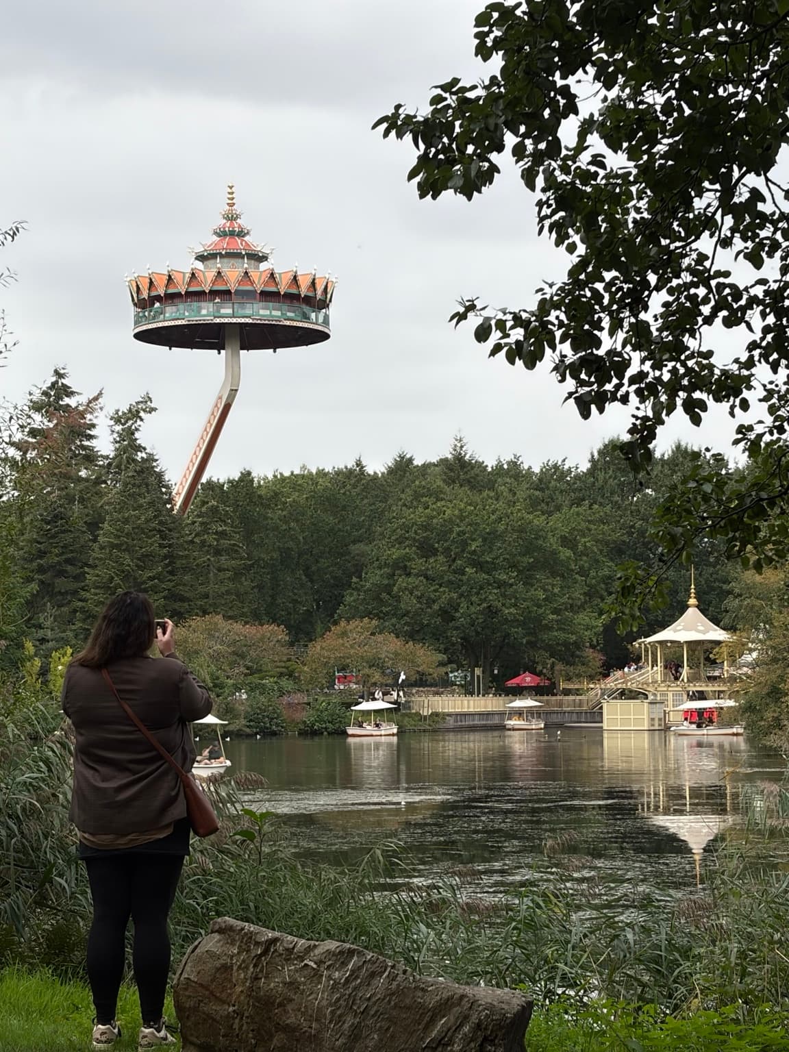 Esther photographing Pagode above the lake and small boats at Efteling